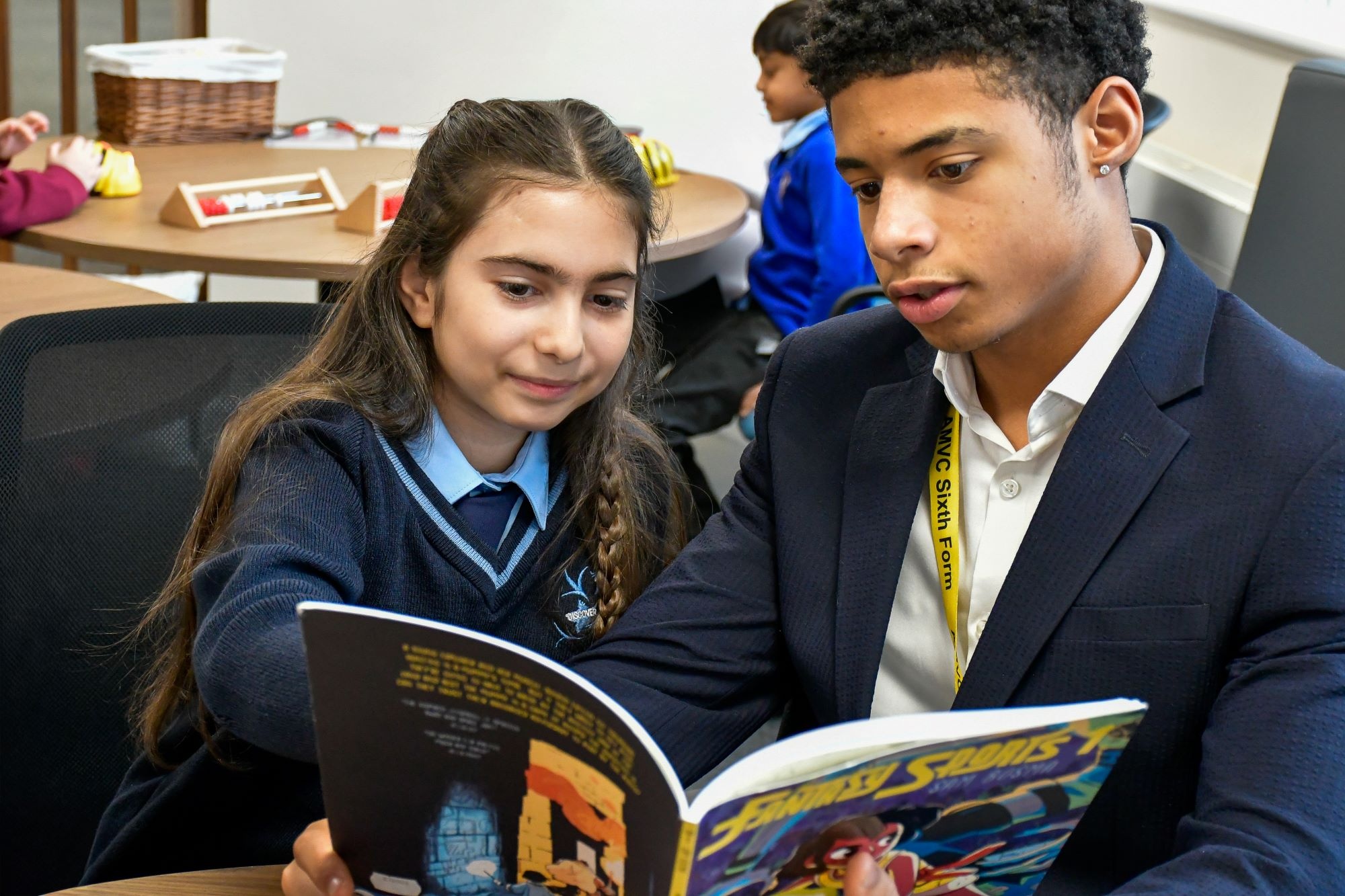 Two students browsing a book
